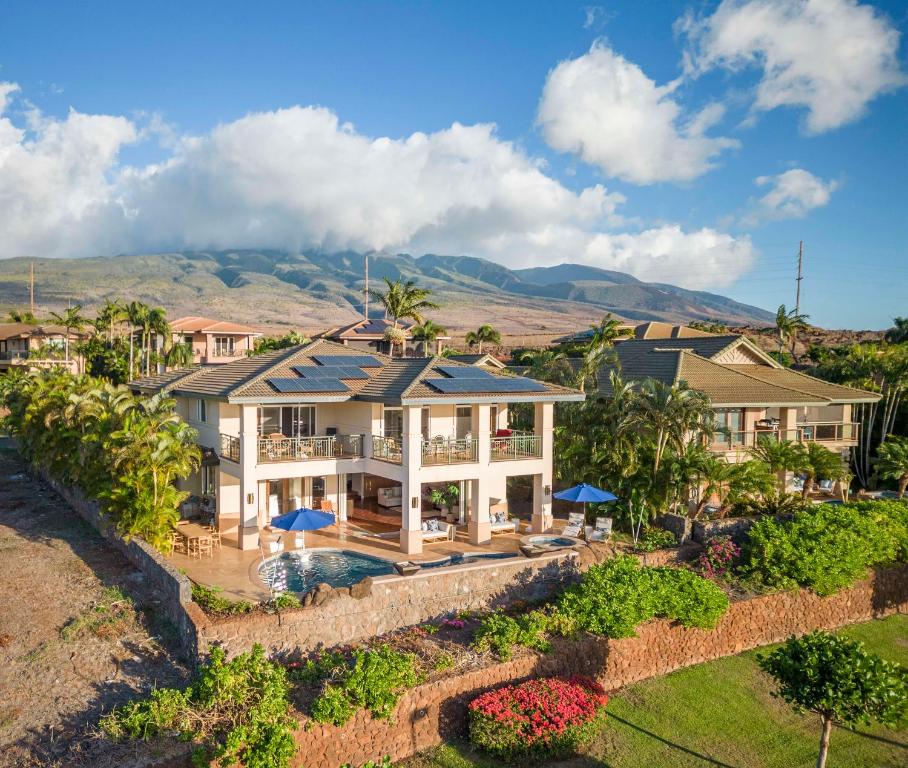 an aerial view of a house with a swimming pool at Breathtaking Oceanfront Lahaina Villa in Lahaina