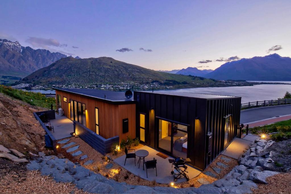 a house on a hill with a view at Mountain Lake Vista Studio in Queenstown