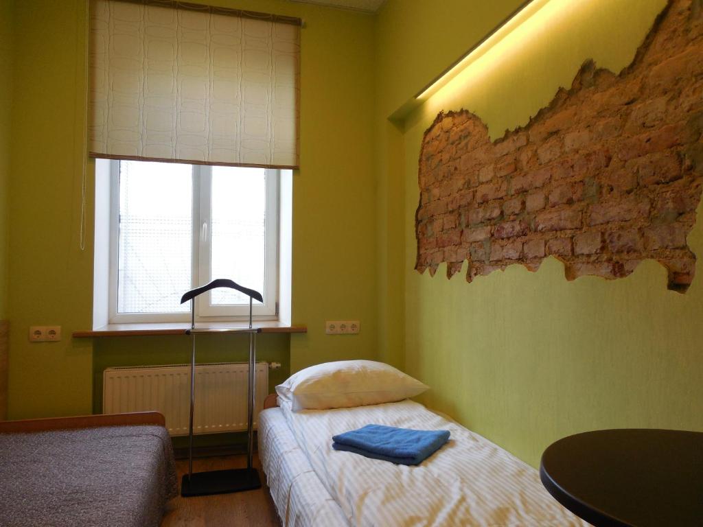 Postel nebo postele na pokoji v ubytování Gogol Park Rooms