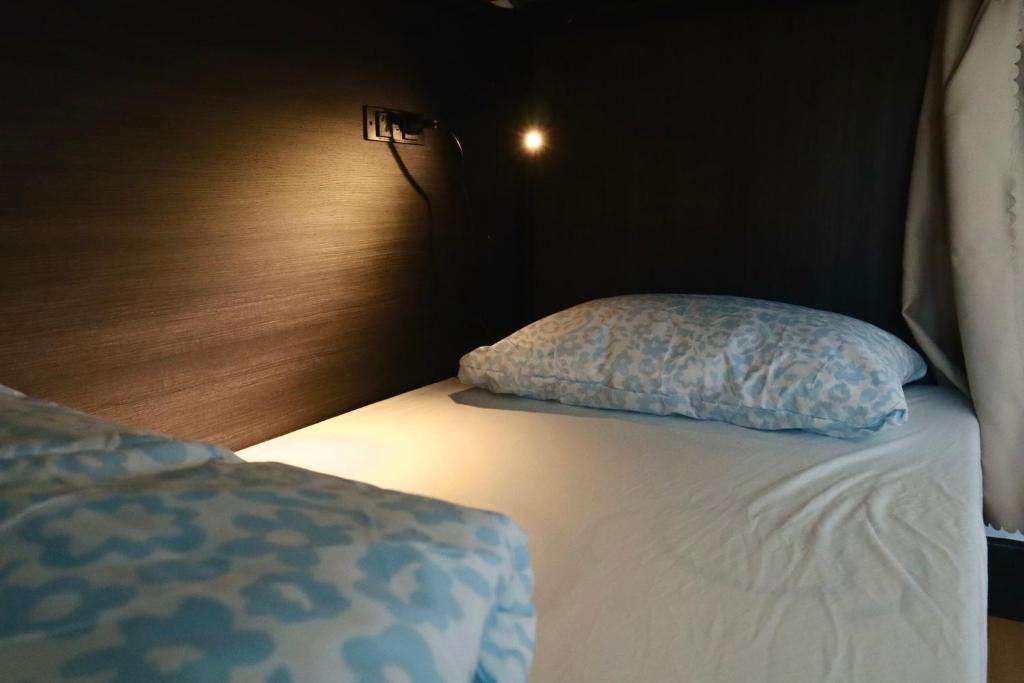 Postel nebo postele na pokoji v ubytování Ritz For Backpackers