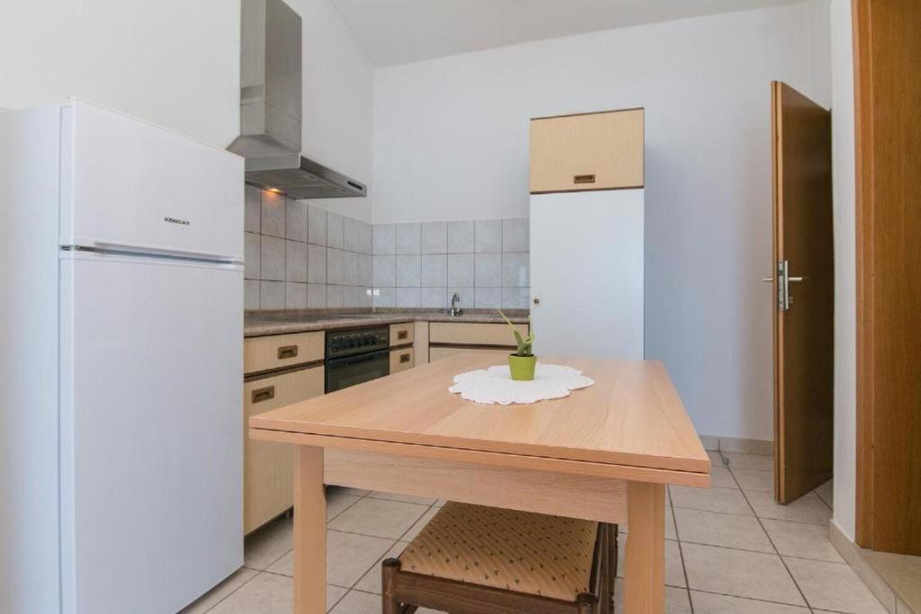 Kuchyň nebo kuchyňský kout v ubytování Apartments Gordan