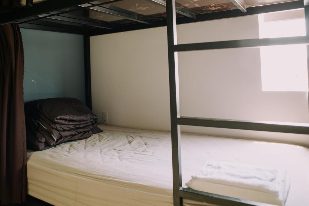 Postel nebo postele na pokoji v ubytování Talofofo Hostel