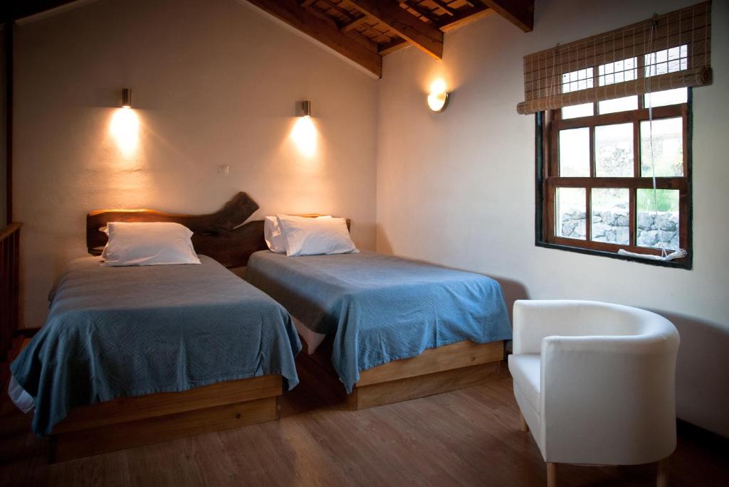 Postel nebo postele na pokoji v ubytování Hotel os Moinhos