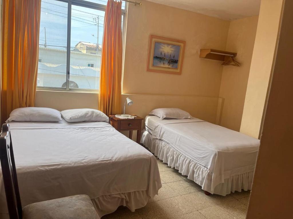 Postel nebo postele na pokoji v ubytování Hotel Mileto