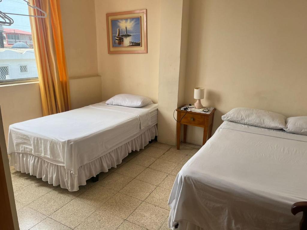 Postel nebo postele na pokoji v ubytování Hotel Mileto