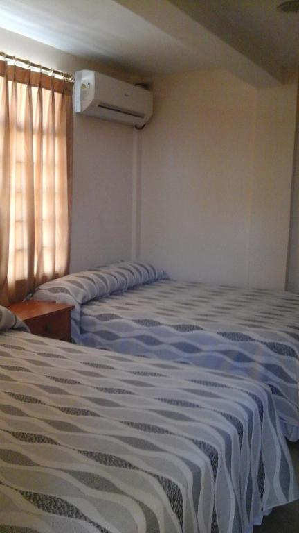 Postel nebo postele na pokoji v ubytování Hotel Mileto