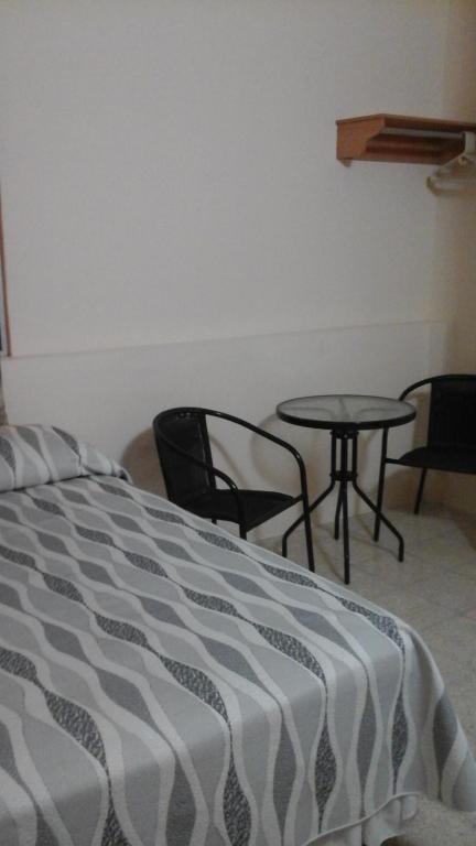 Postel nebo postele na pokoji v ubytování Hotel Mileto