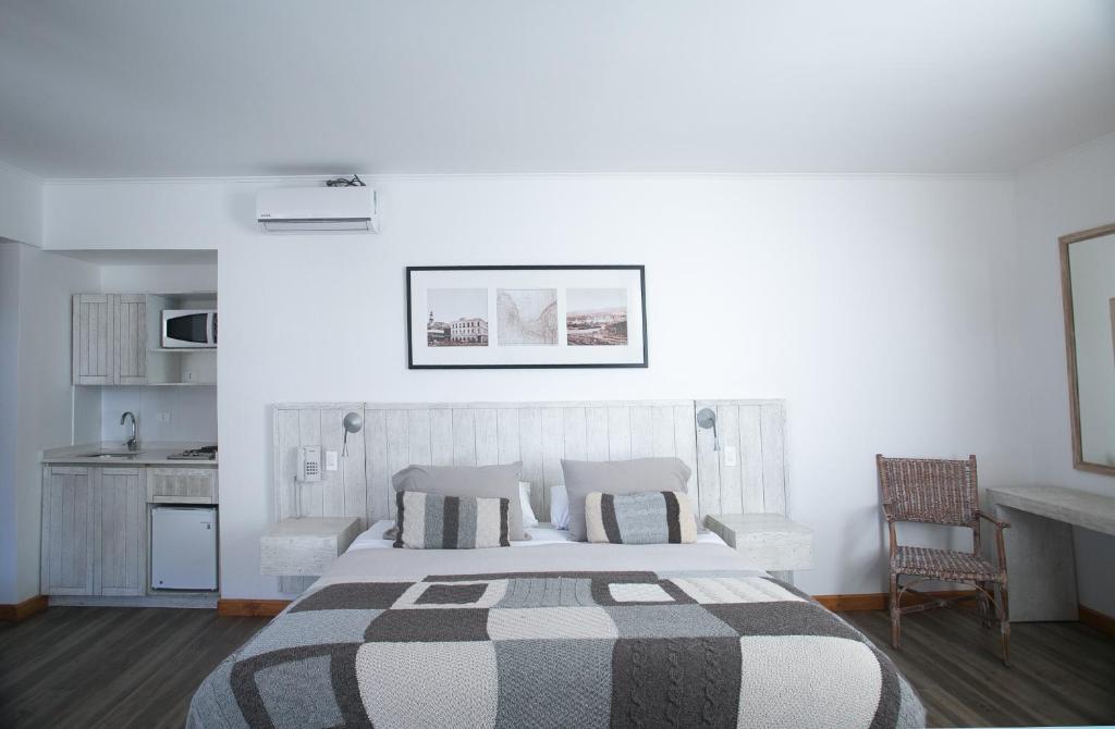 Postel nebo postele na pokoji v ubytování Casa Galos Hotel & Lofts