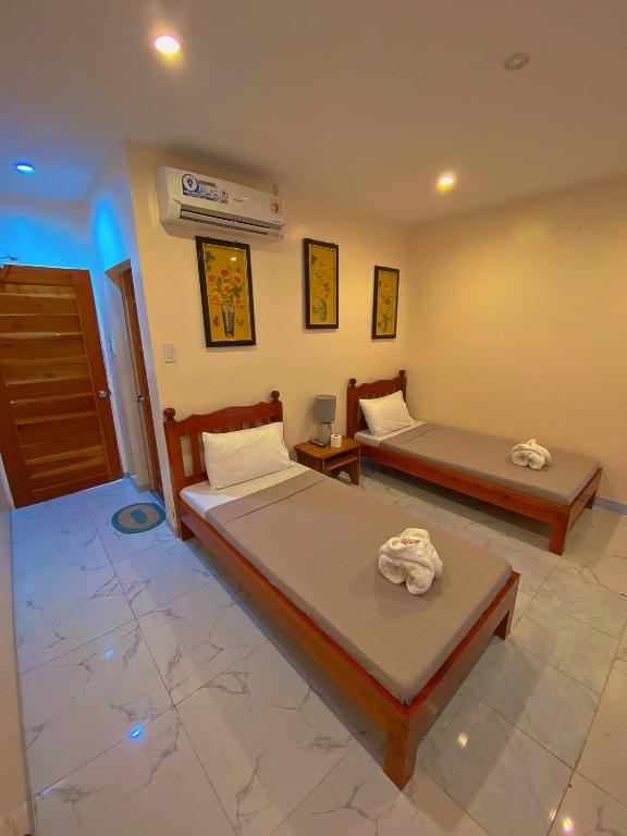 Postel nebo postele na pokoji v ubytování Elnora Delmar Travellers Inn