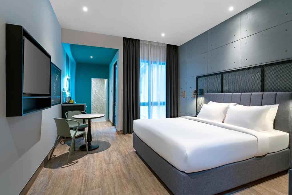 Postel nebo postele na pokoji v ubytování ibis Styles Sepang KLIA