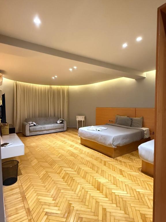 Postel nebo postele na pokoji v ubytování NUT Pyramids Hotel