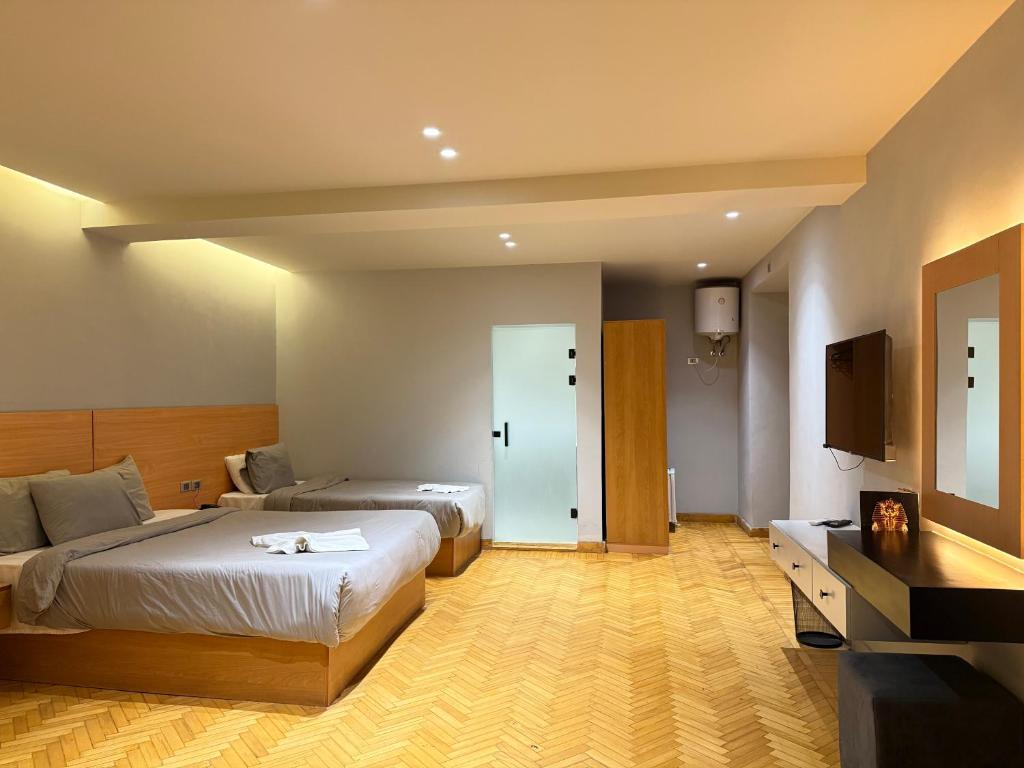 Postel nebo postele na pokoji v ubytování NUT Pyramids Hotel