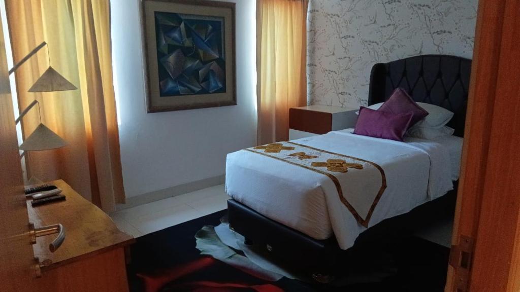 Postel nebo postele na pokoji v ubytování Kupu Kupu Jimbaran Beach Hotel & Spa by L’Occitane
