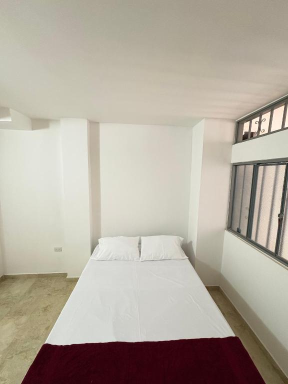 Postel nebo postele na pokoji v ubytování Hotel Dauphin Rest