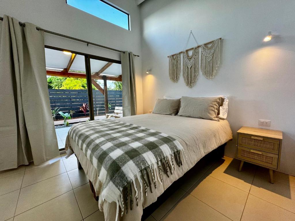 Ένα ή περισσότερα κρεβάτια σε δωμάτιο στο Makihi Suites
