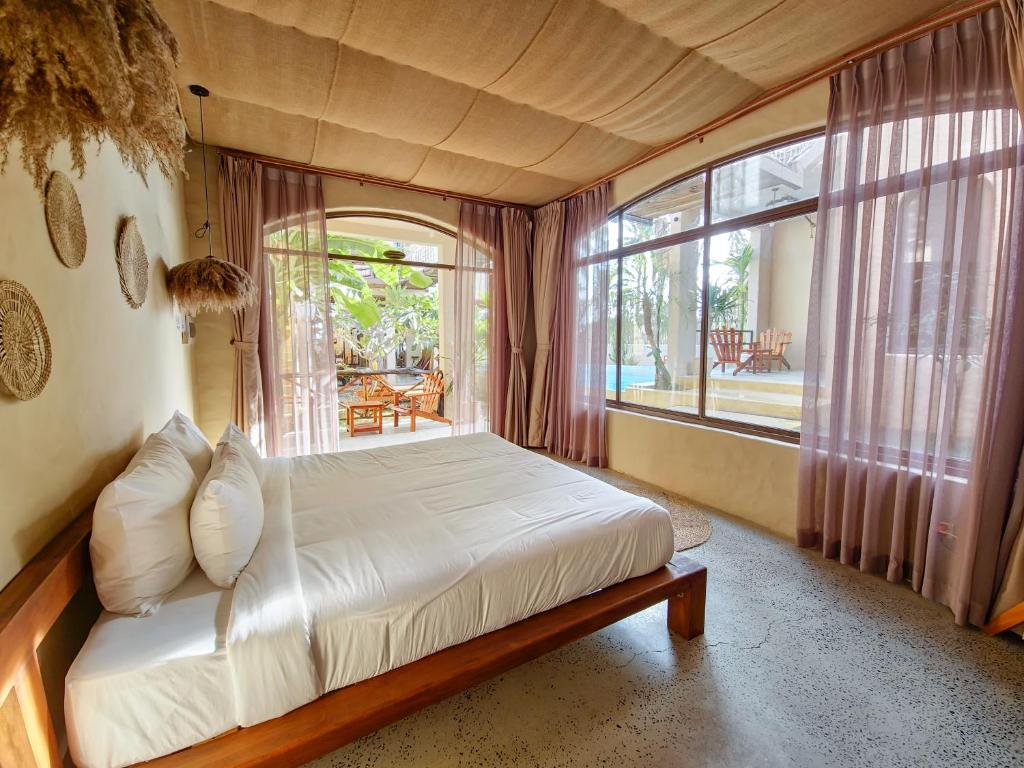 Giường trong phòng chung tại Red Sands Mui Ne