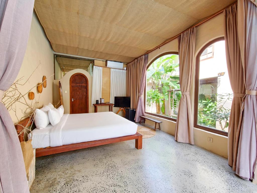Giường trong phòng chung tại Red Sands Mui Ne