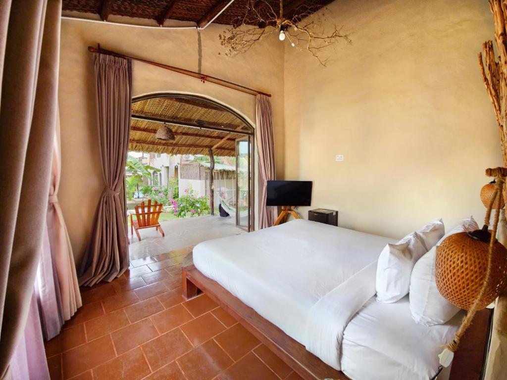 Giường trong phòng chung tại Red Sands Mui Ne