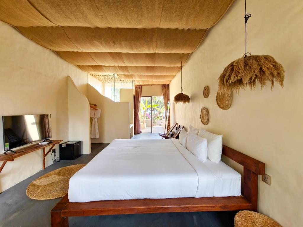 Giường trong phòng chung tại Red Sands Mui Ne