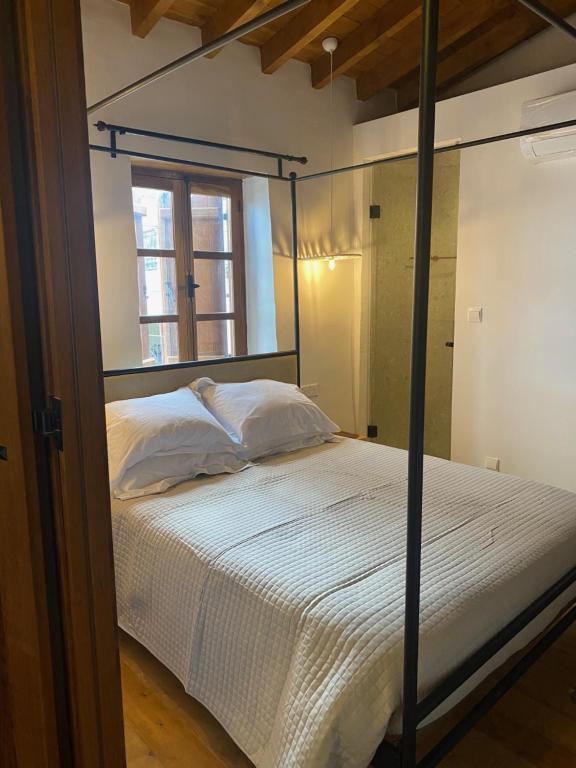Postel nebo postele na pokoji v ubytování Spiti Urania