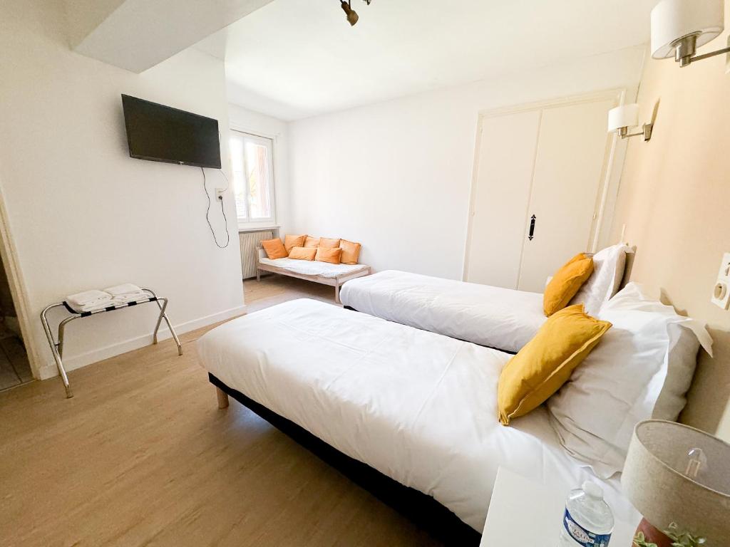 Postel nebo postele na pokoji v ubytování Hôtel Comme chez soi