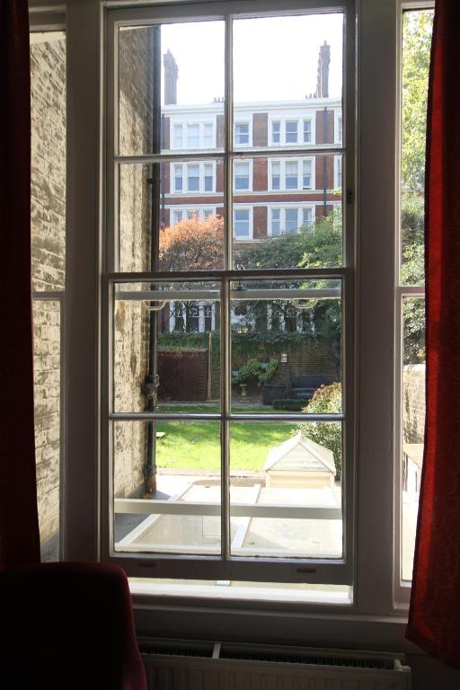 a window with a view of a building at Ridgemount Hotel in London
