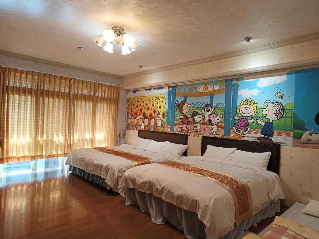 Postel nebo postele na pokoji v ubytování Jinge Guest House 集集金格民宿電動車充電站