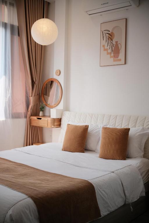 Giường trong phòng chung tại Glory Hue Homestay