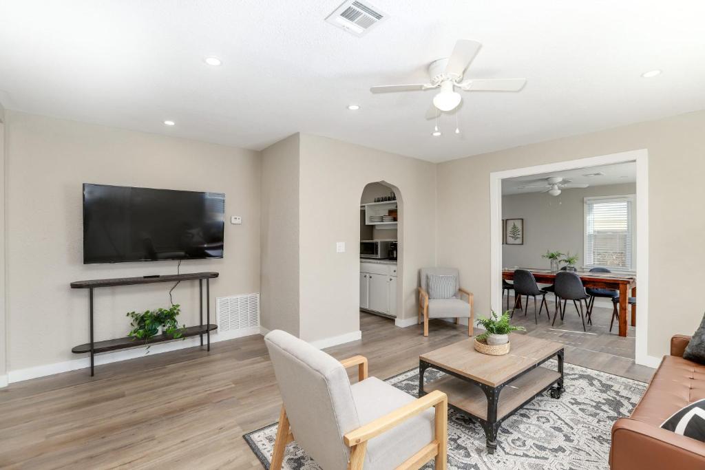 a living room with a flat screen tv on the wall at SUPER CUTE 3 BR 1 BA WIFI Smrt TV 2 Living RM in Wichita