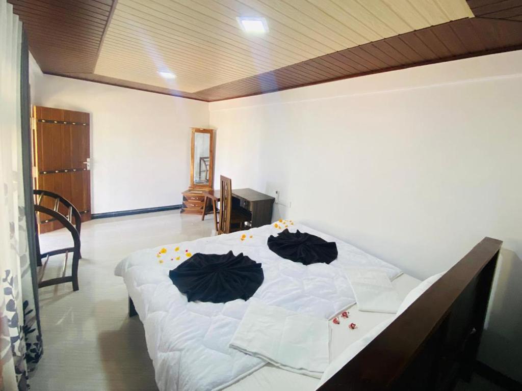Postel nebo postele na pokoji v ubytování Sunset view Homestay Sigiriya