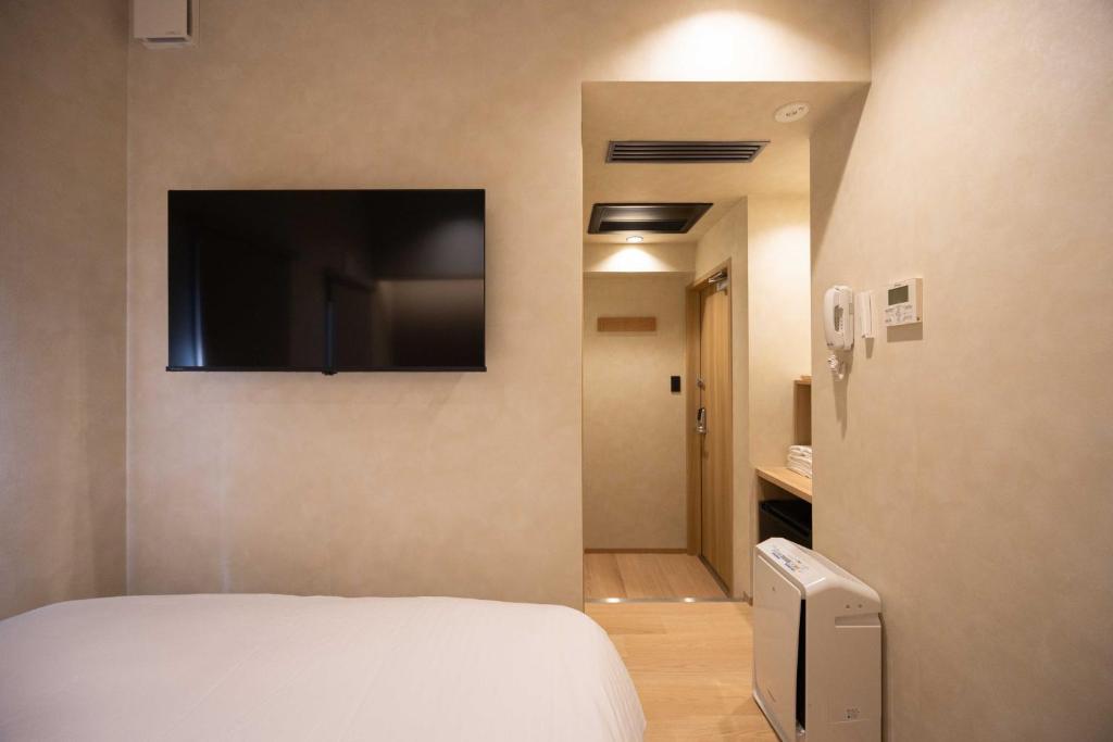 Postel nebo postele na pokoji v ubytování Hotel Paul House