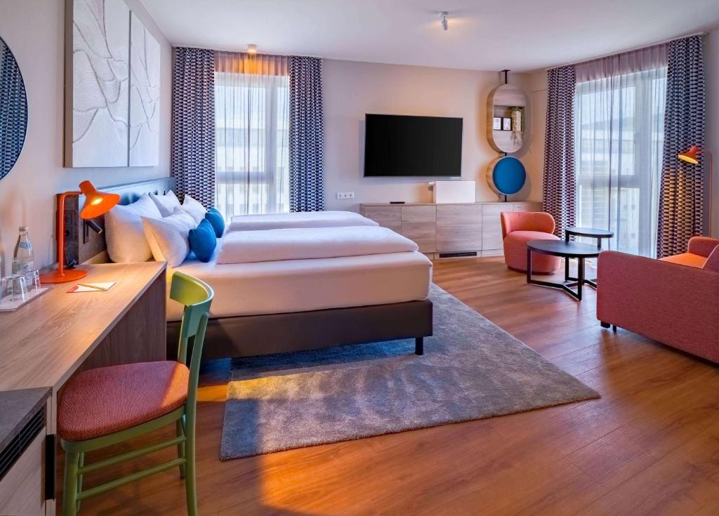 Letto o letti in una camera di Ramada Encore by Wyndham Munich Messe