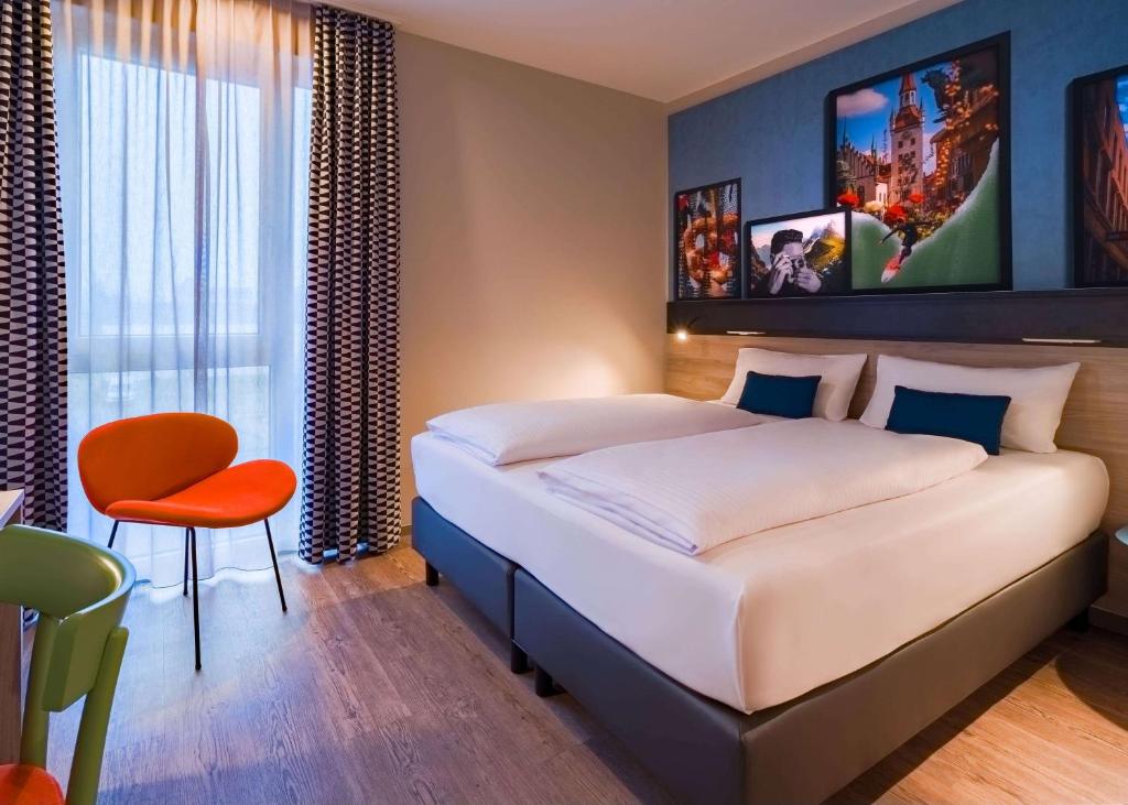 Letto o letti in una camera di Ramada Encore by Wyndham Munich Messe