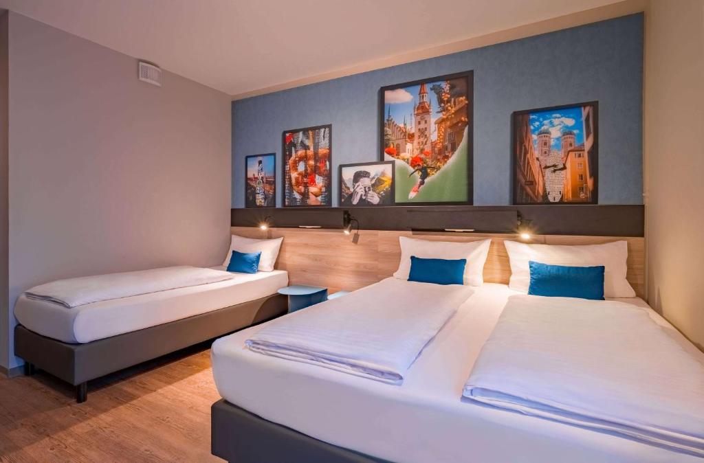 Letto o letti in una camera di Ramada Encore by Wyndham Munich Messe