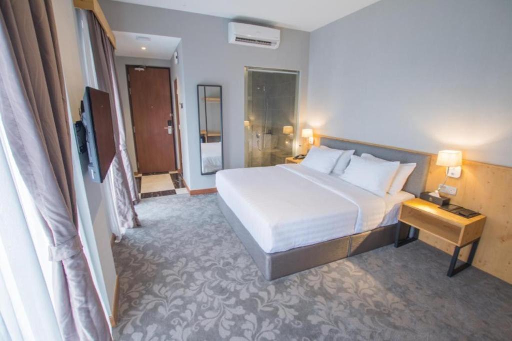 Postel nebo postele na pokoji v ubytování Redpine Boutique Hotel