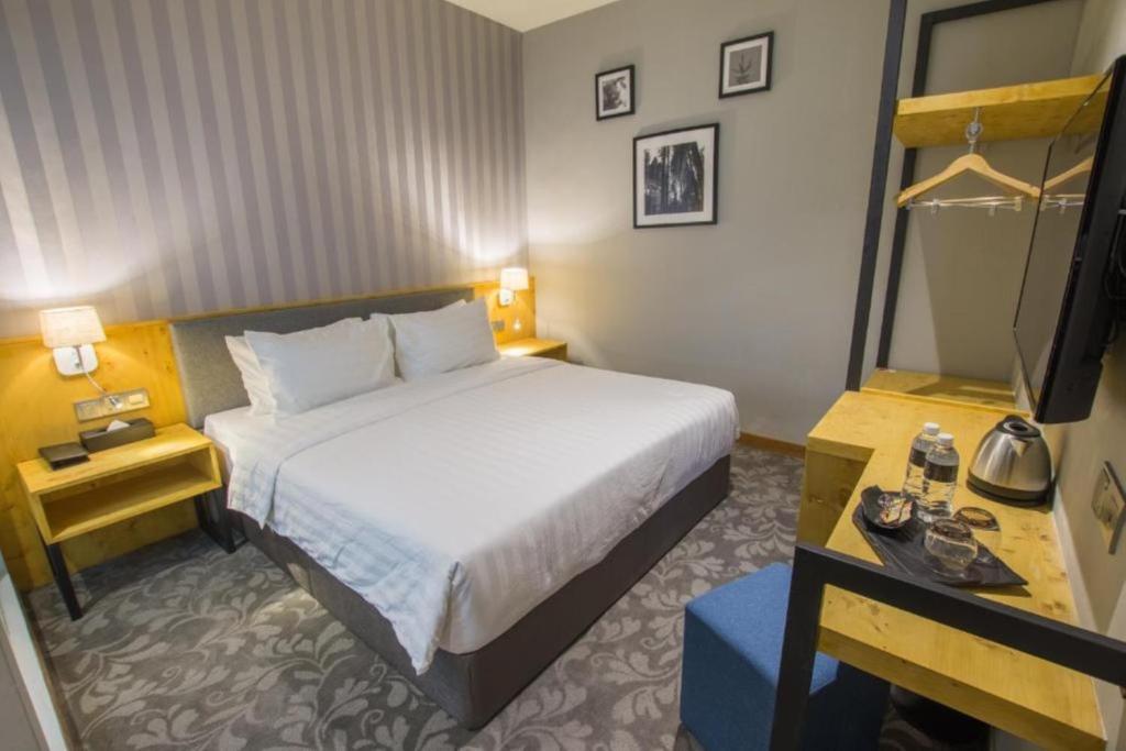 Postel nebo postele na pokoji v ubytování Redpine Boutique Hotel