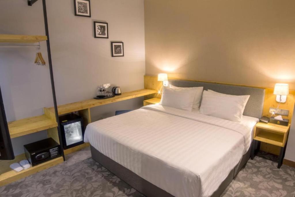 Postel nebo postele na pokoji v ubytování Redpine Boutique Hotel