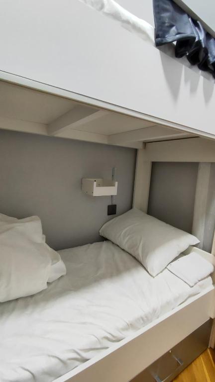 Postel nebo postele na pokoji v ubytování Gunel's Hostel Baku