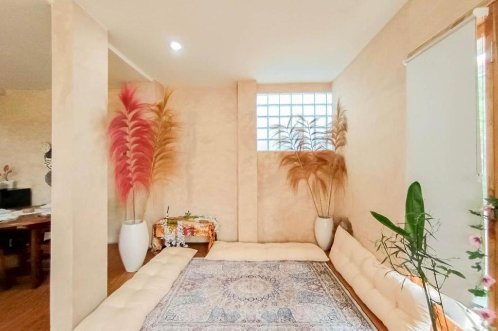 En eller flere senge i et værelse på Elia Bali heaven villa