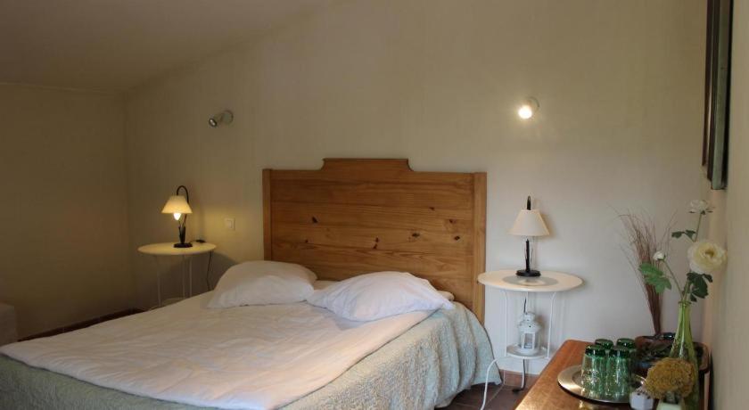 Postel nebo postele na pokoji v ubytování Auberge Pietra Monetta
