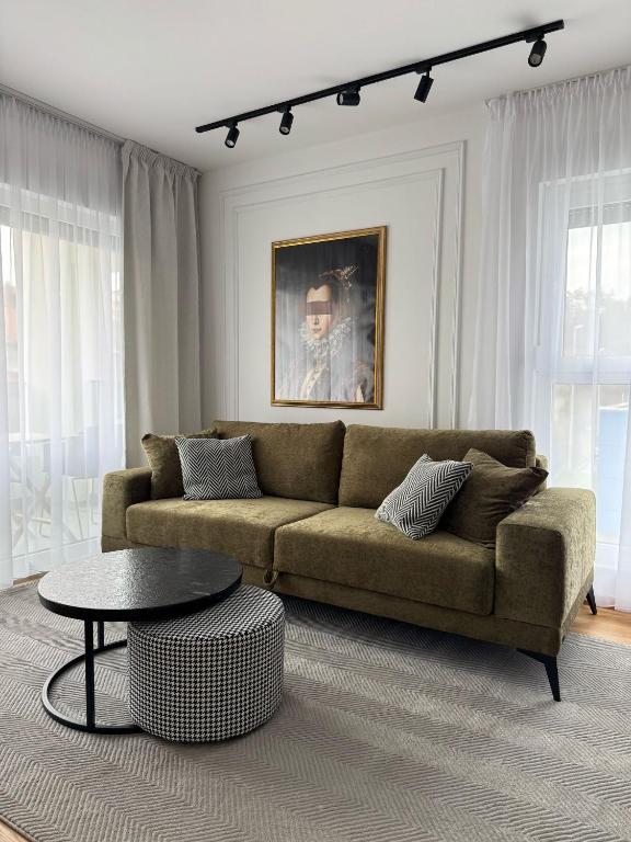 a living room with a couch and a table at Boutique Apartment - Široki Brijeg in Široki Brijeg