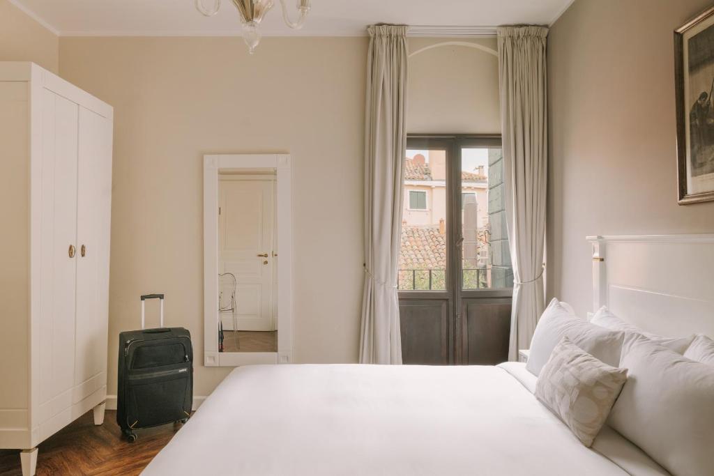 Postel nebo postele na pokoji v ubytování iH Hotels Venezia Salute Palace