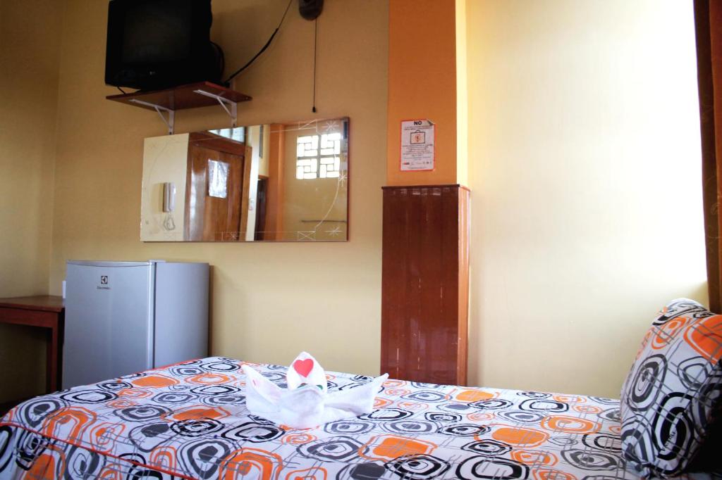 Una cama o camas en una habitación de Hostal Ventura Isabel