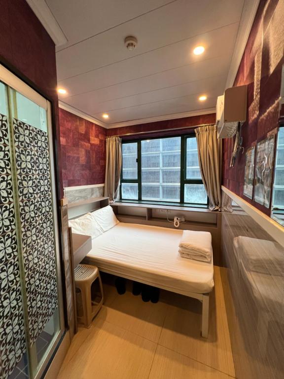 A bed or beds in a room at USA Hostel HONG KONG