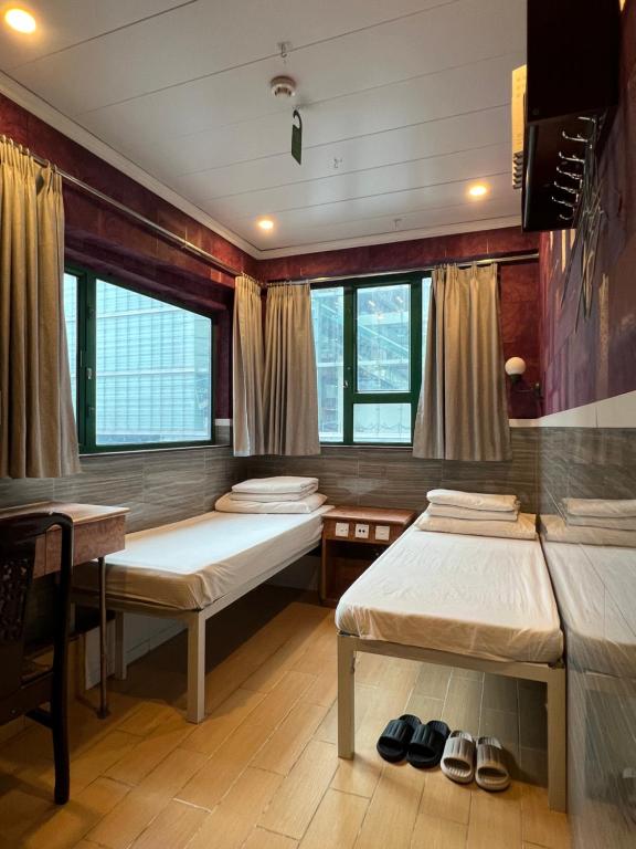 A bed or beds in a room at USA Hostel HONG KONG
