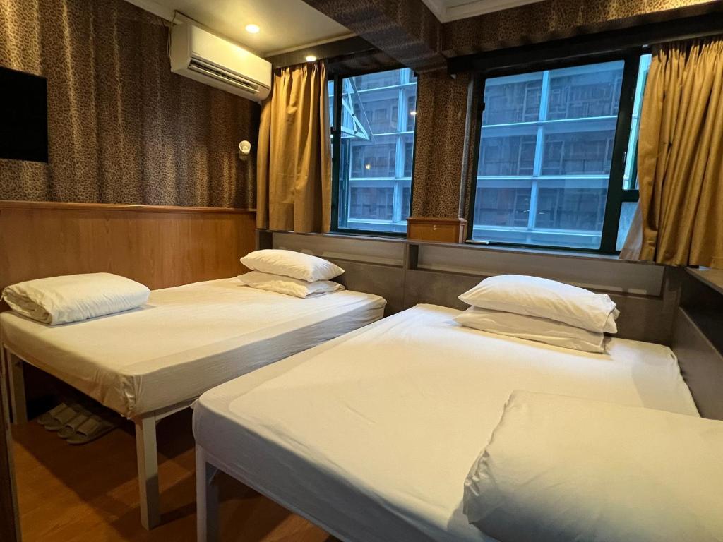A bed or beds in a room at USA Hostel HONG KONG
