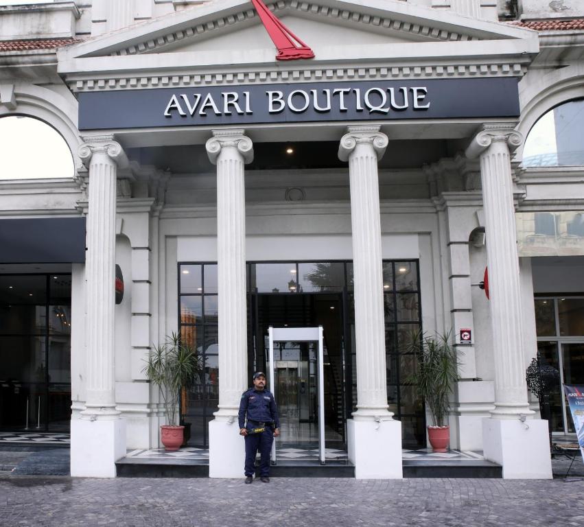 a woman standing in front of a building at Avari Boutique Gujranwala in Fattu Mand