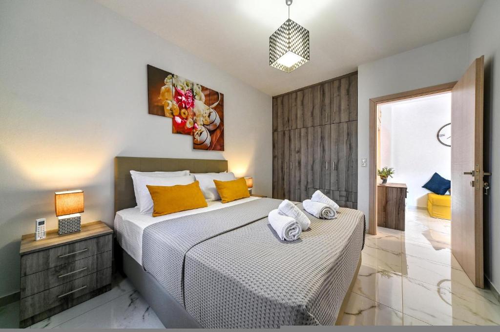 A bed or beds in a room at Seaside Apartments in Agkisaras 2