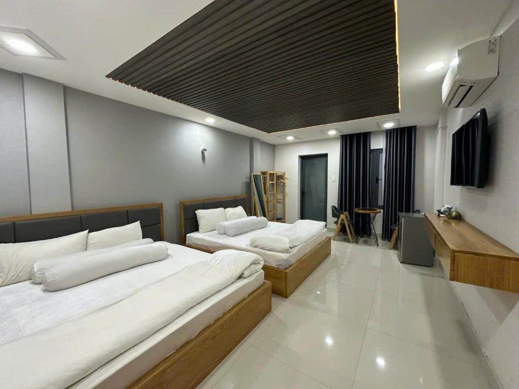 Postel nebo postele na pokoji v ubytování Hotel & Homestay LABUBU