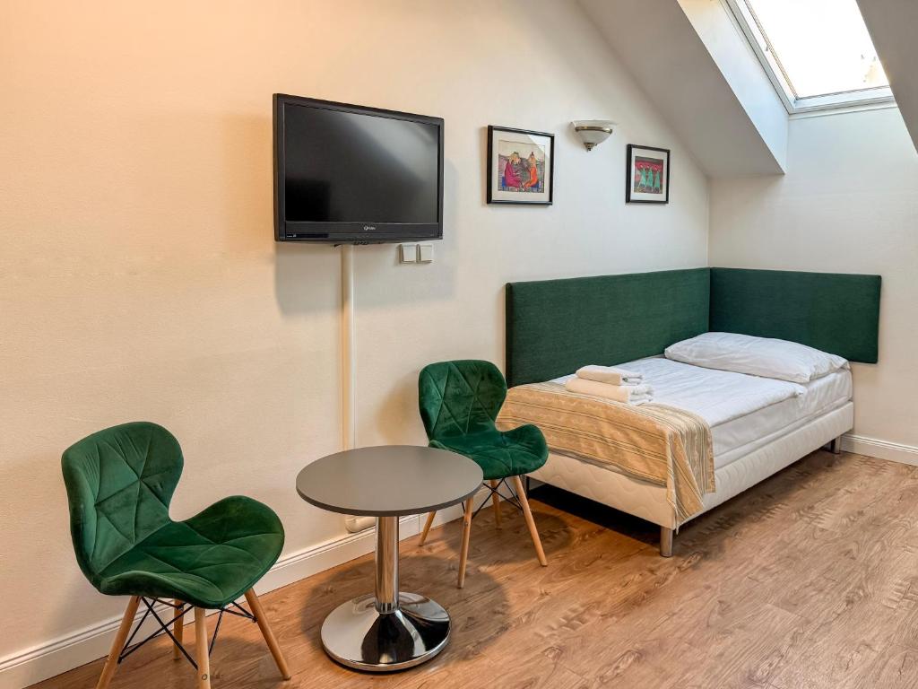 Postel nebo postele na pokoji v ubytování Hotel Malá Strana